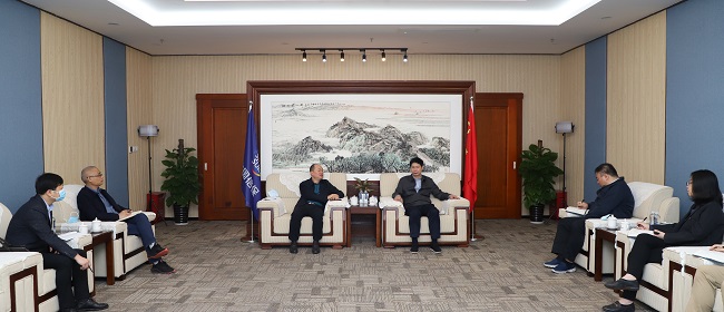 唐农生会见中国信保广西分公司总经理张显